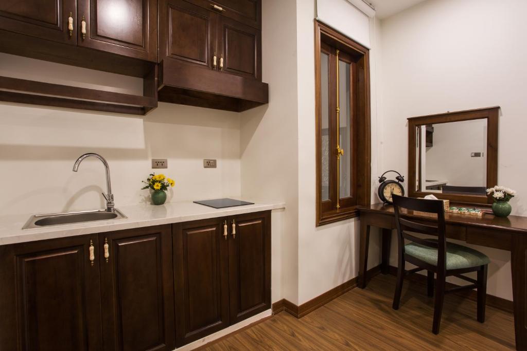 Kuchyň nebo kuchyňský kout v ubytování Maro Hotel