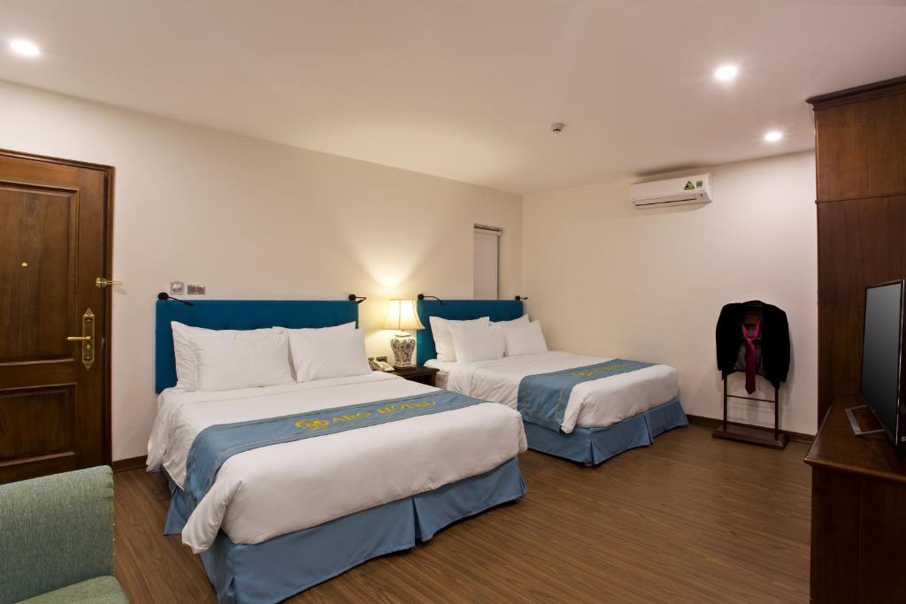 Postel nebo postele na pokoji v ubytování Maro Hotel