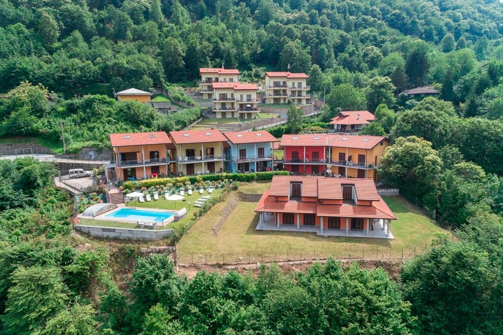 an aerial view of a house with a swimming pool at Residence Borgo Castello B1 Apartment in Argegno