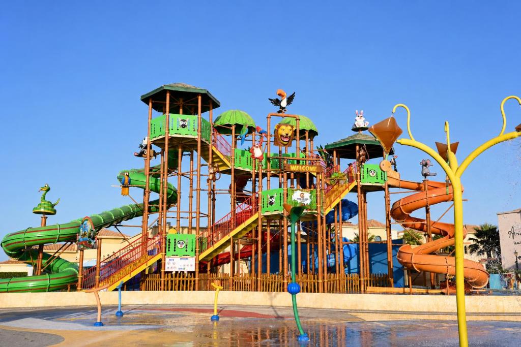 a large water park with a water slide at The Grove Resort Bahrain in Manama