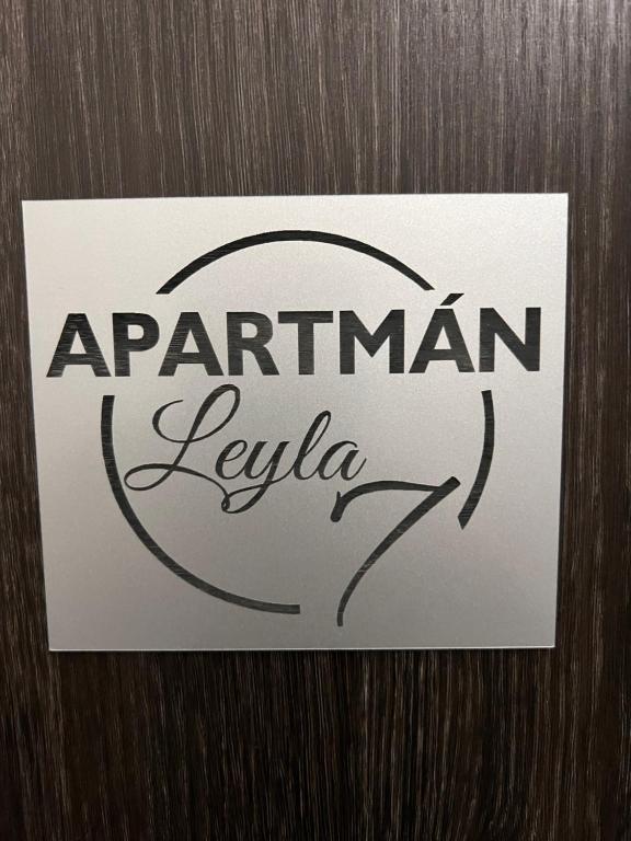 a sign on a door that says argentinian leivo at Centrum Apartman LEYLA 7 in Bardejov
