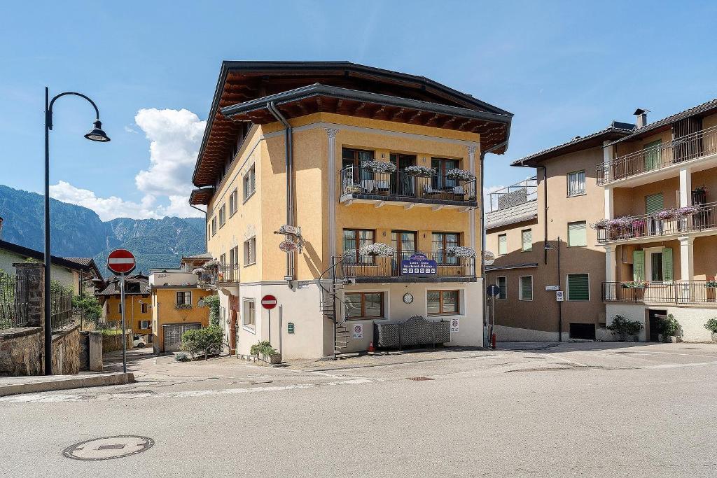 a building on the corner of a street at Alla Loggia dell'Imperatore in Levico Terme