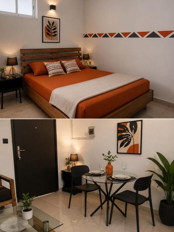 a bedroom with a bed and a table and a dining room at HAPPY WELCOME Biétry 3 - MARCORY ZONE 4 in Abidjan