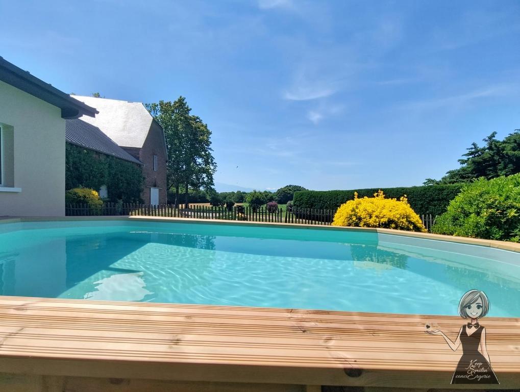 a swimming pool with a toy in front of a house at Maison Miqueu 6ch-3sdb 4/15 pers-Pau-Lourdes in Andoins