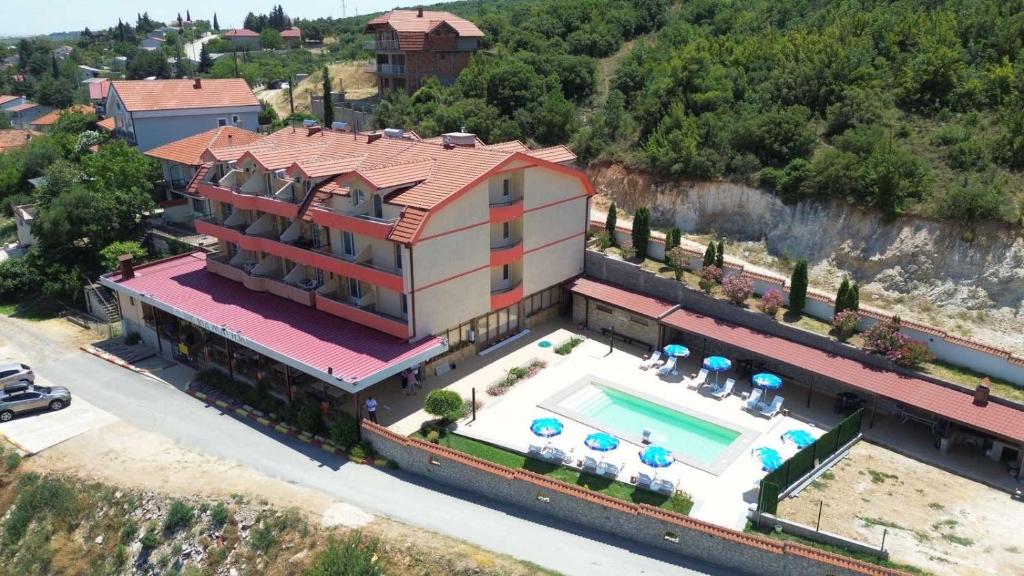 an aerial view of a house with a swimming pool at Villa Marija - Izgrev in Star Dojran
