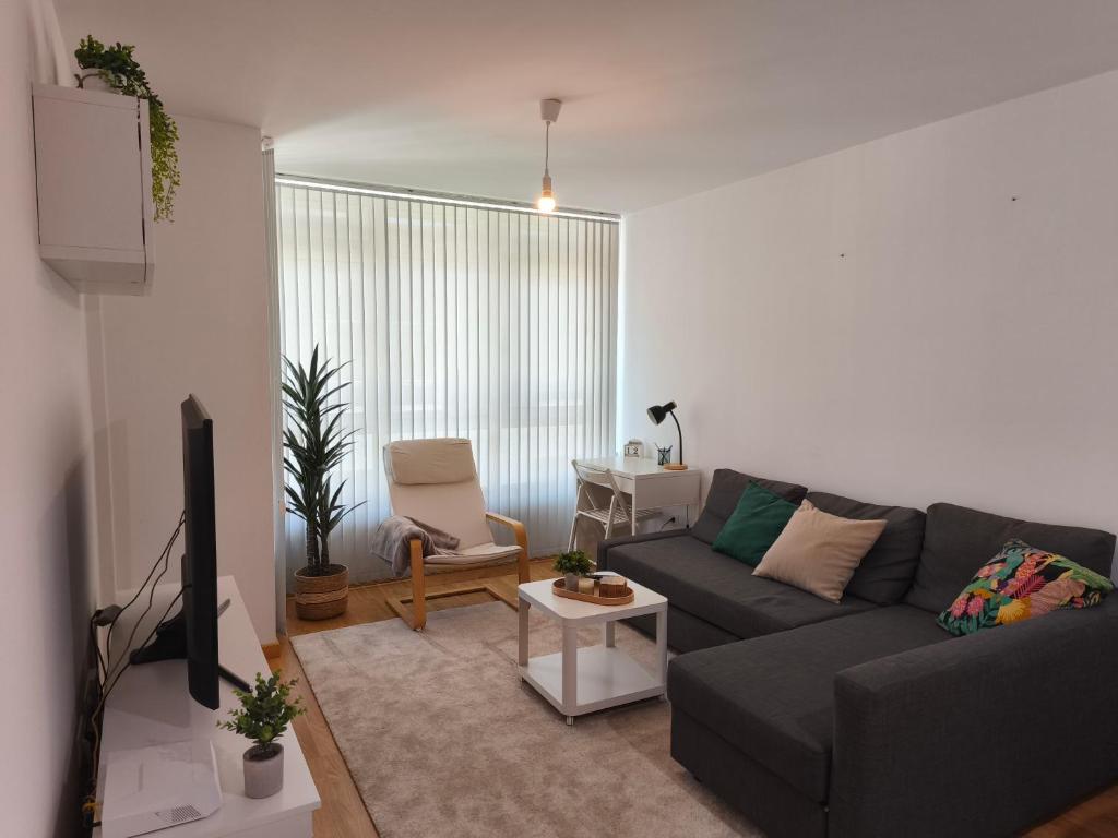 a living room with a couch and a tv at Piso en Cedeira in Cedeira