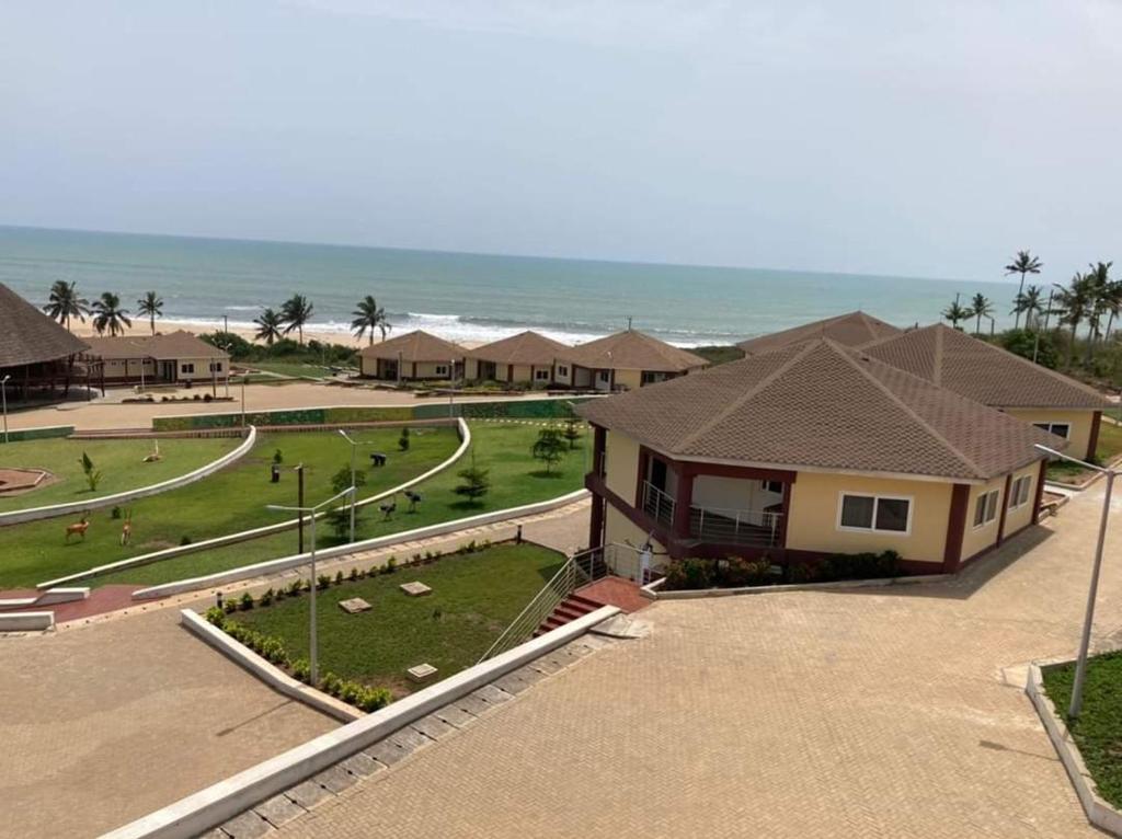an aerial view of a resort with the beach at Nyansapo Eco Resort in Cape Coast