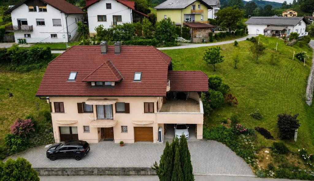 a house with a car parked in front of it at Premium house Anika in Rogaška Slatina