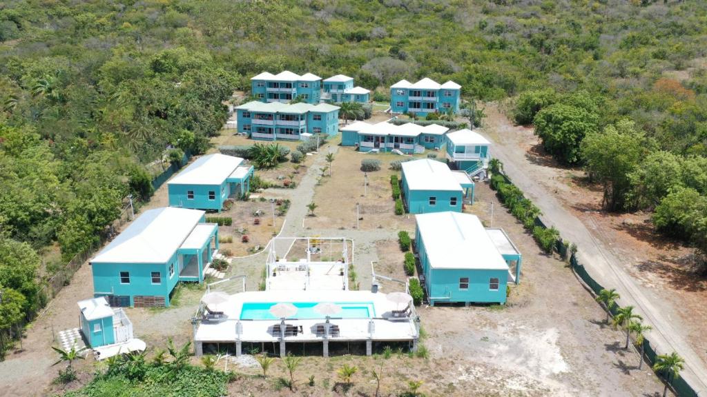 an aerial view of a row of blue and white houses at Neem View Apartments - Studio in Falmouth