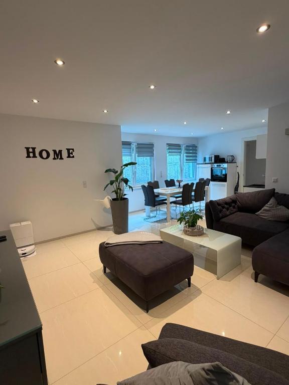 a living room with a couch and a table at Beautiful living in Schönaich