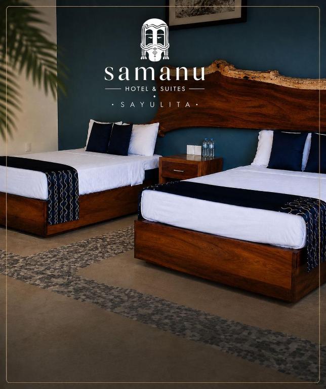 two beds in a room with two bedsitures at Samanu Hotel & Suites in Sayulita