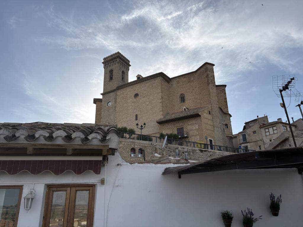 a large building with a tower on top of a building at El Redoble de Moratalla in Moratalla