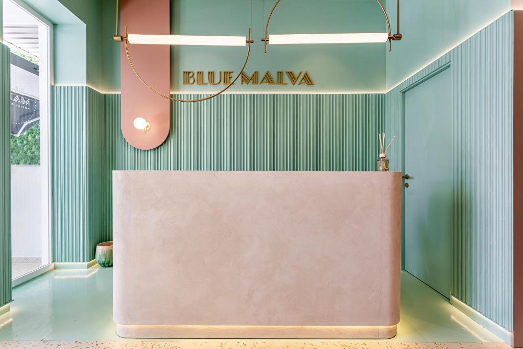 a large table in a room with a sign on the wall at Blue Malva in Valencia