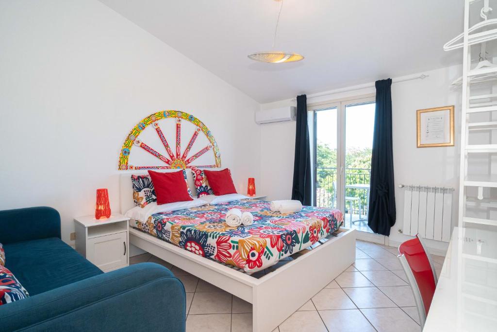 a bedroom with a bed with a ferris wheel at New Naxian Holidays in Giardini Naxos