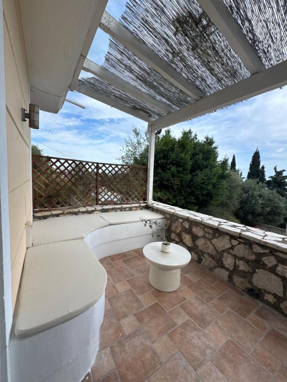 a bathroom with a toilet on a balcony at Aura di Mare in Barbati
