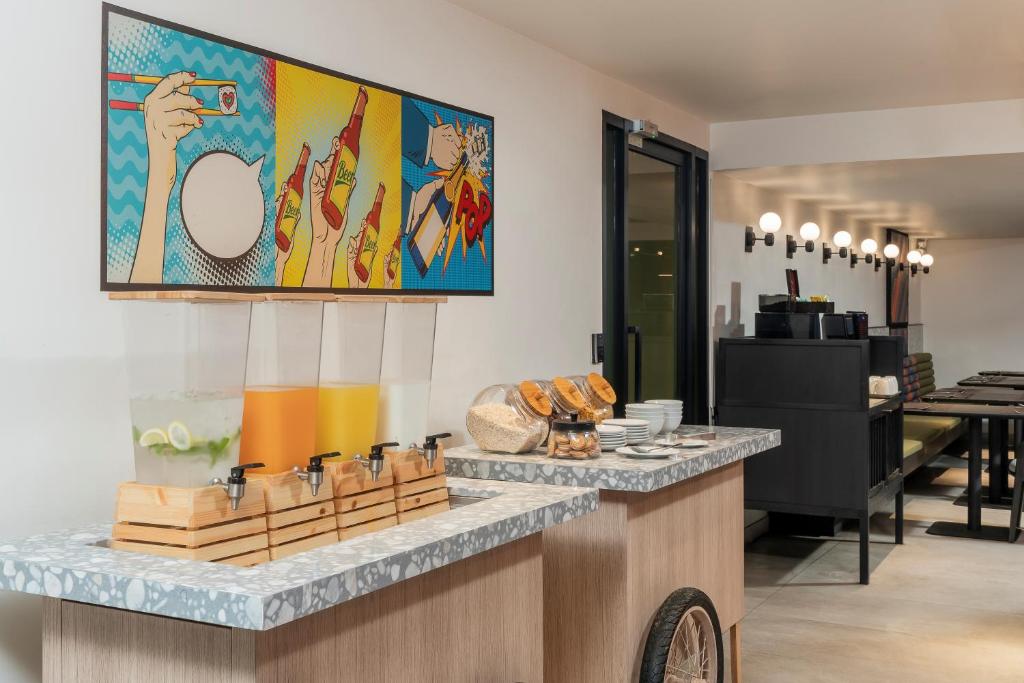 A compact breakfast station serving juice, fruit, bread and hot drinks.