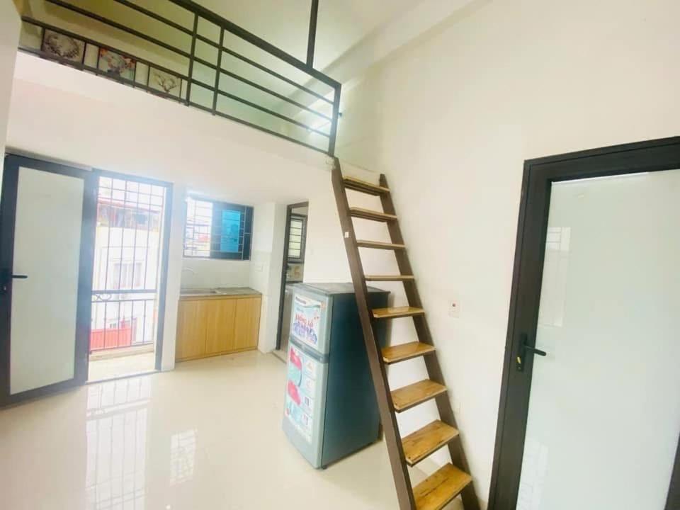 a room with a loft bed and a ladder at 46 An Hòa, Mỗ lao in Hanoi