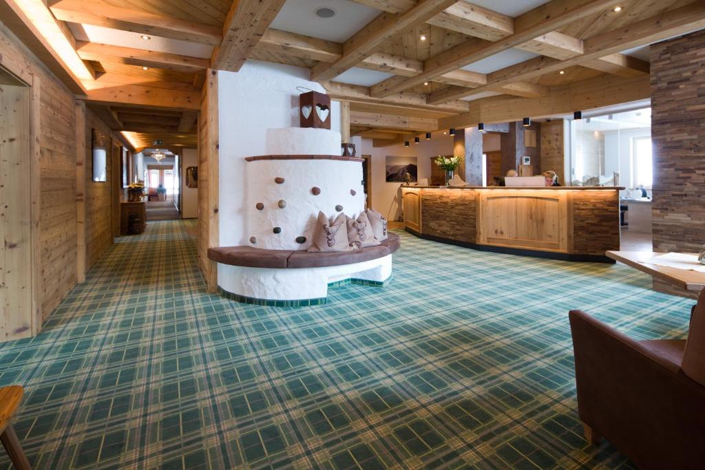 a large lobby with a wedding cake on a table at Hotel Bergland in Pertisau