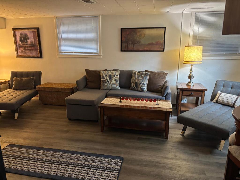 a living room with a couch and a coffee table at Oasis Studio in Cambridge