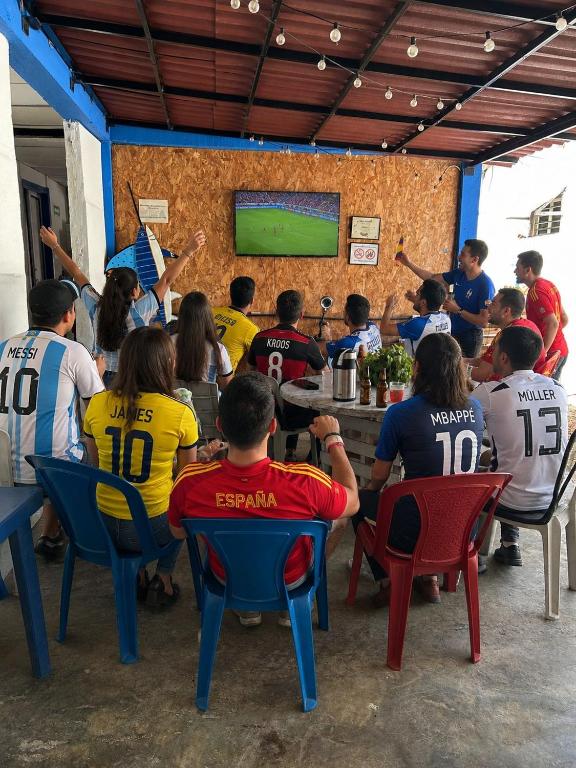 a group of people sitting in chairs in a room at Mango Tree Hostel CTG 420 in Cartagena de Indias