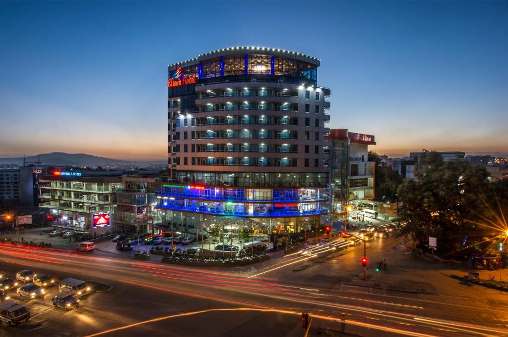 un edificio de noche con una calle delante en Grand Eliana Hotel Conference & Spa en Addis Abeba