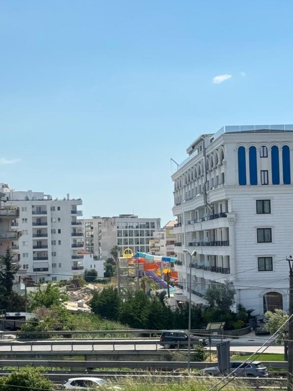 a view of a city with buildings and a freeway at Arkej Pool Aparthotel in Golem