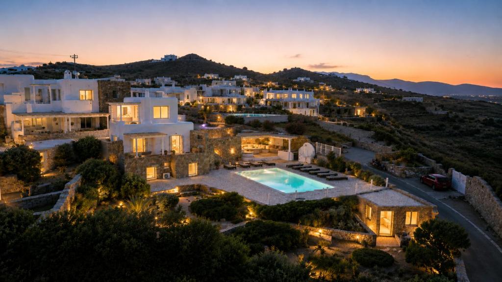 an aerial view of a villa at night at Your private Mykonos Villa in Kalafatis