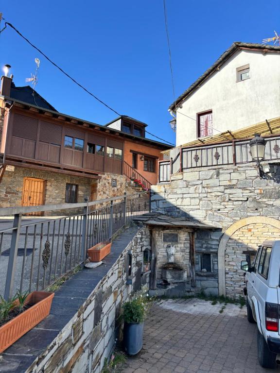 a building with a stone fireplace in front of a building at Santa Cruz del sil in Santa Cruz del Sil