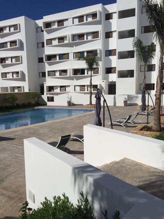a view of the apartment building from the pool at Iken Park Agadir in Agadir