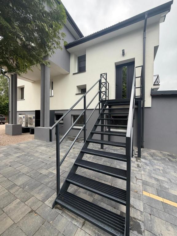 a set of stairs in front of a house at Apartamenty Sznurki in Sznurki