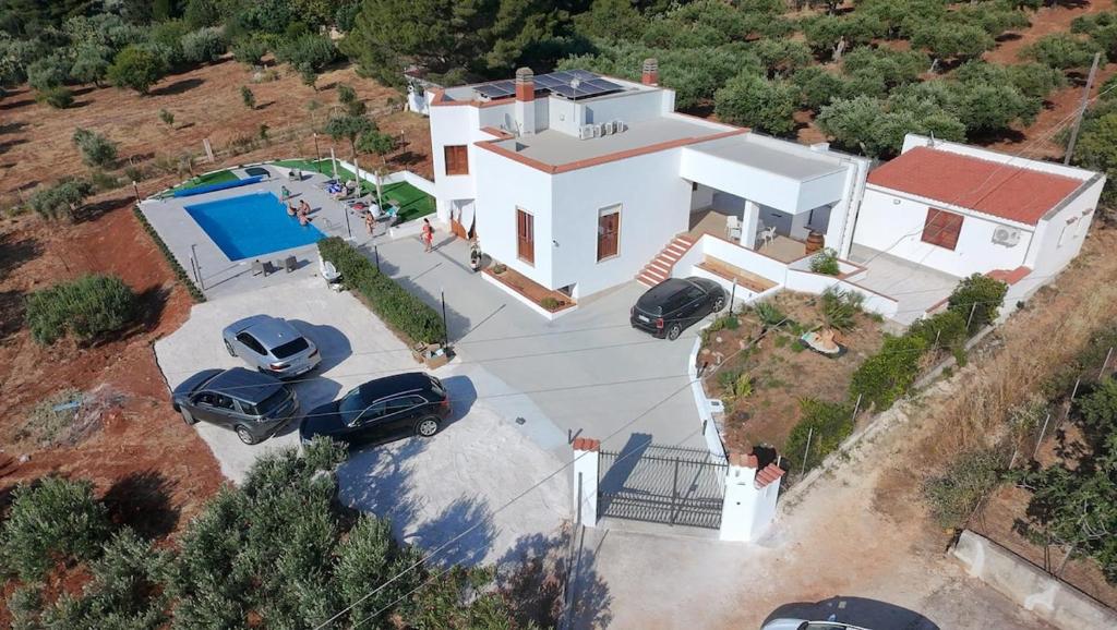 an overhead view of a white house with a car parked at Villa Silvia in Erice