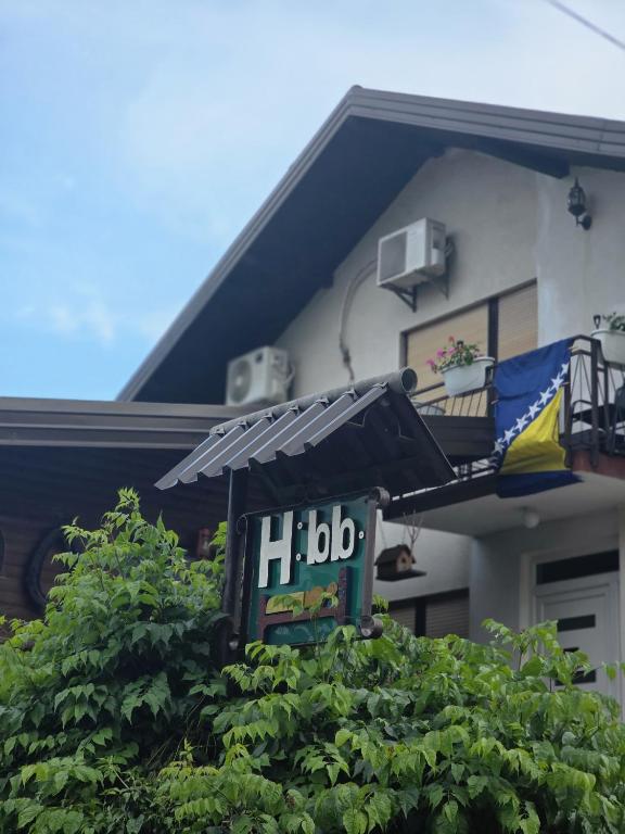 a house with a hbo sign in front of it at Horizont apartmans in Jajce