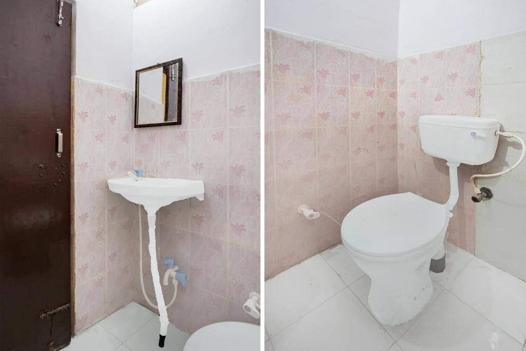 a bathroom with a toilet and a sink at Hotel O Sector 12 Ghaziabad Formerly VIP Inn in Ghaziabad