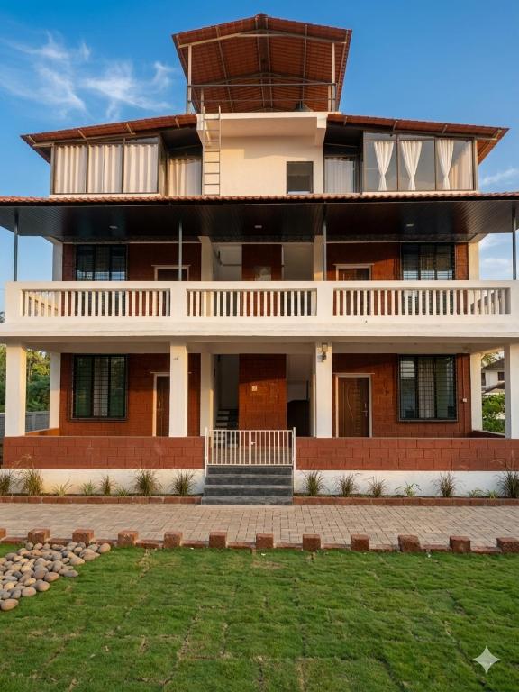 a large building with a lawn in front of it at CP Villa Resort in Bhāweghar