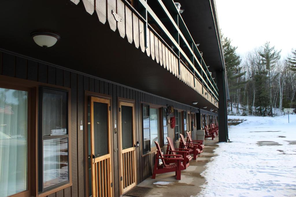 a row of chairs sitting outside of a building at Ledge Rock at Whiteface in Wilmington