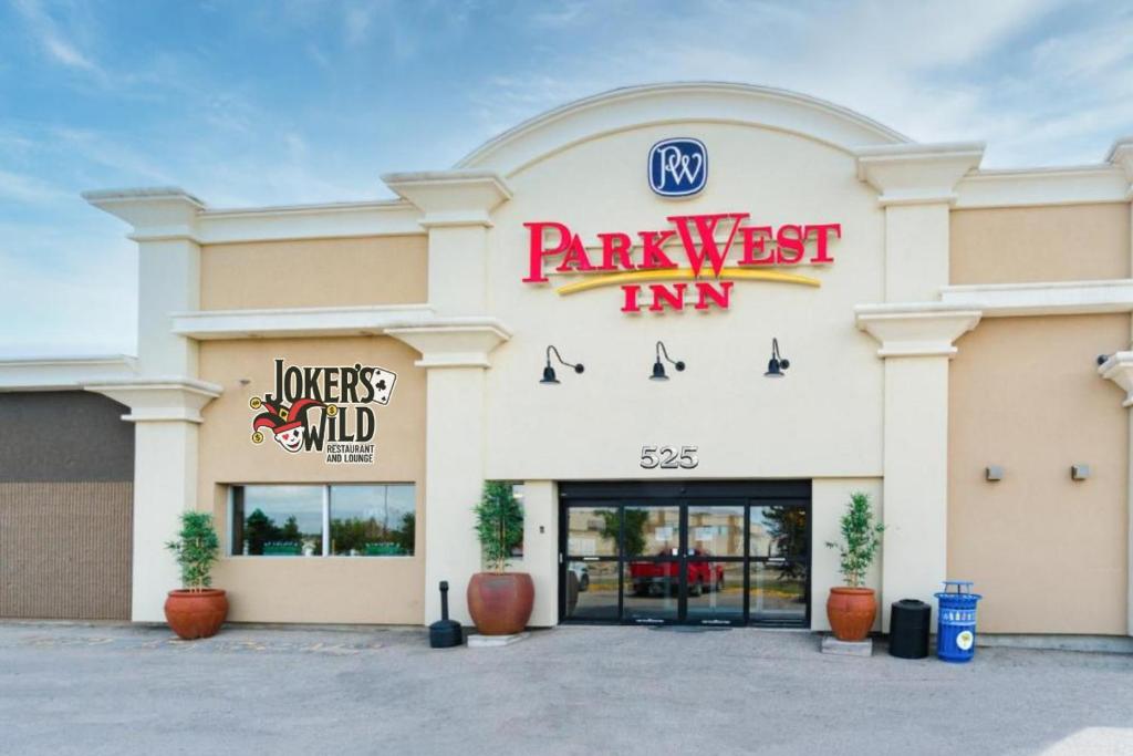 a park west inn sign on the front of a building at Park West Inn in Saint James