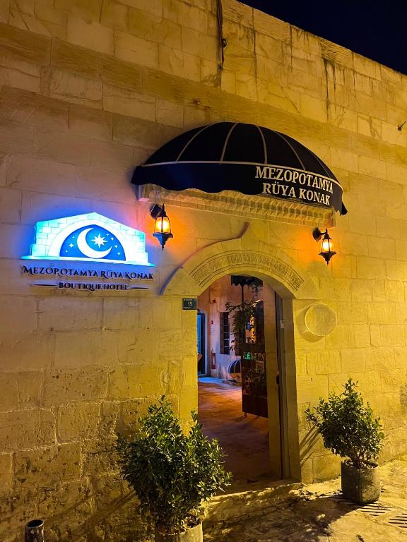 a building with a sign that reads mexican pizza house at Mezopotamya Ruya Konak in Urfa