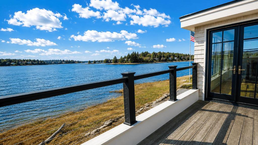 a house with a view of the water at Robbins Nest in Essex