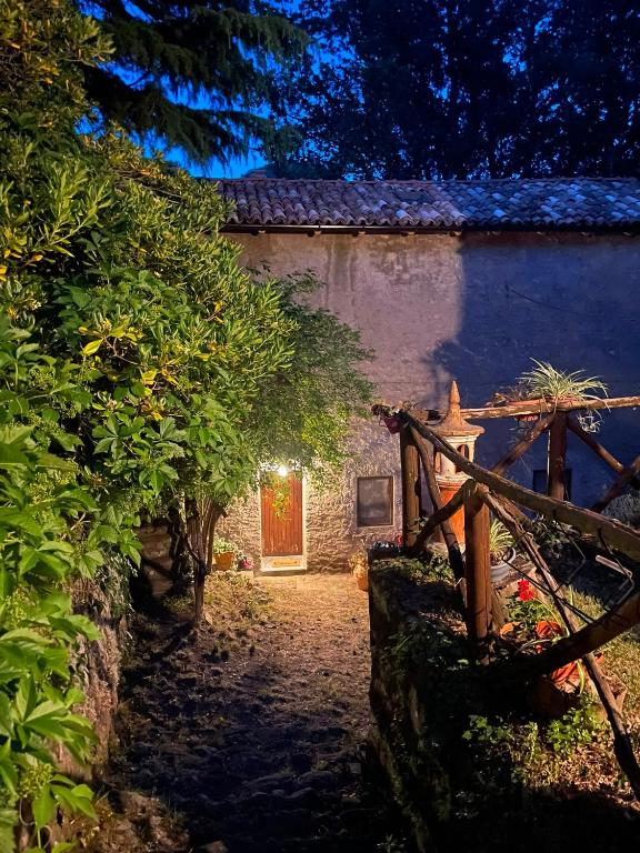 an entrance to a house with a wooden fence at Borgo Il Monzone in Castel dʼAiano