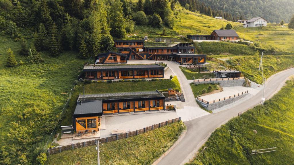 an aerial view of a house on a hill at Panoramic Residence in Borşa