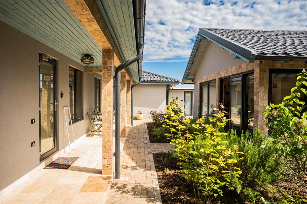 a house with a walkway between two buildings at VAMA 25- Vama Veche in Vama Veche