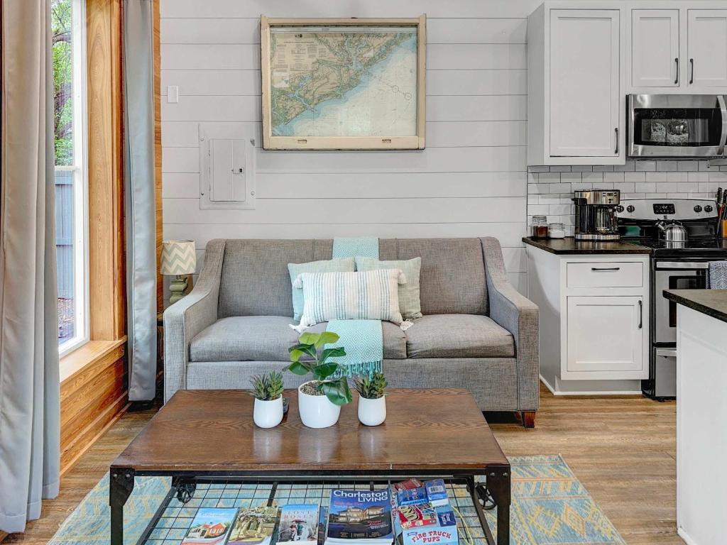a living room with a couch and a coffee table at Island Retreat - Great for Large Groups in Charleston
