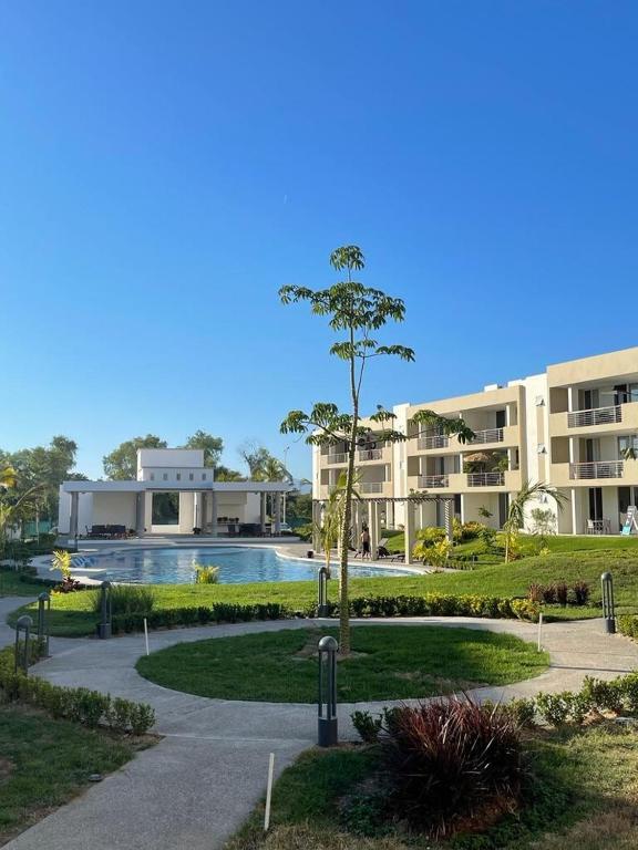 a large building with a swimming pool and a courtyard at Villa Evelia, Pool, Near Nuevo Vallarta in Mezcales