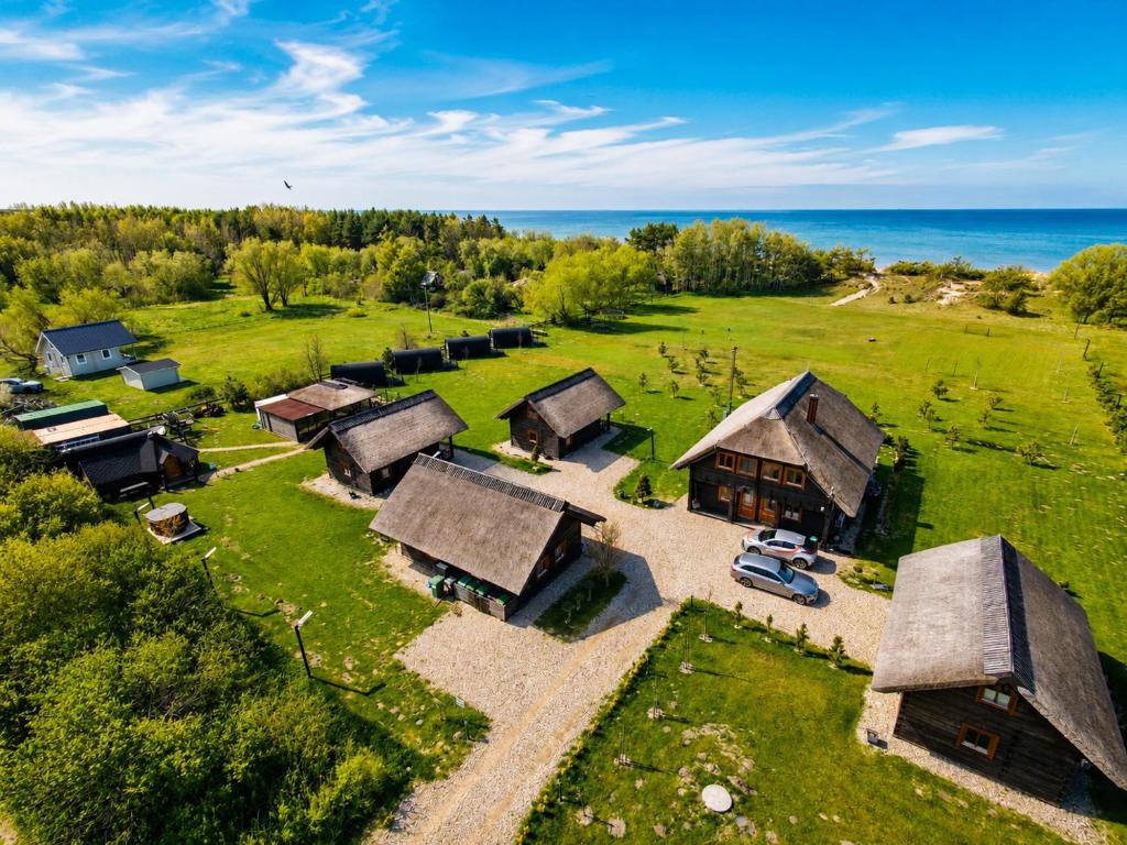 an aerial view of an old farm with buildings at KOPUVA seaside villas in Nida