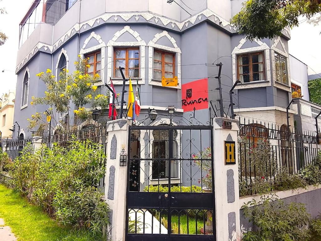 a building with a gate in front of it at Runcu Arequipa in Arequipa