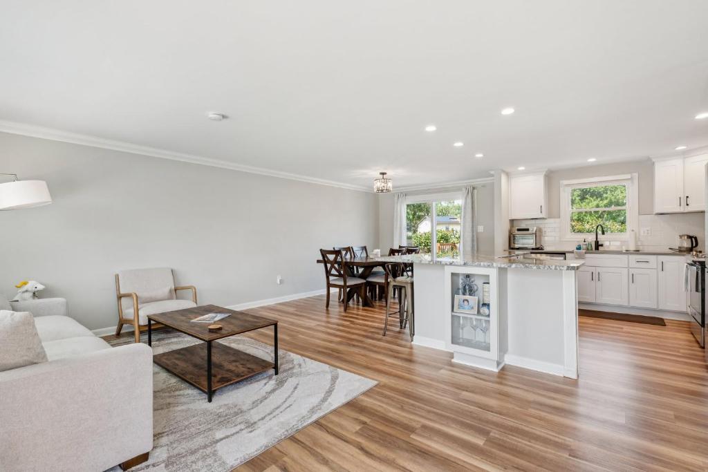 a living room with a couch and a table at Renovated 3BR Near Sandy Point Beach in Annapolis