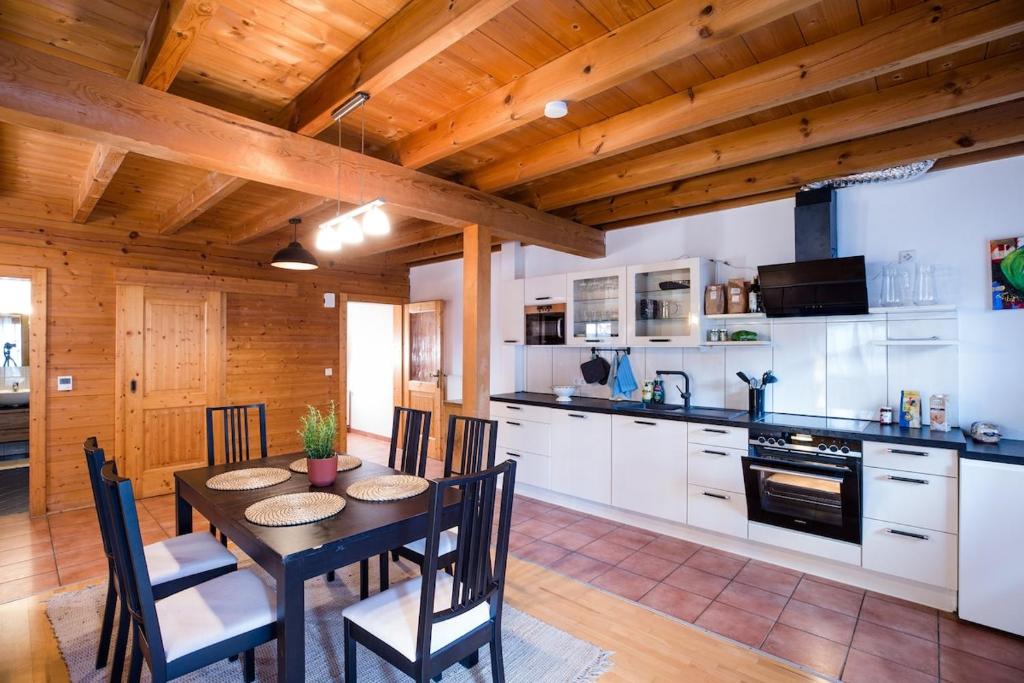a kitchen with a table and chairs in a room at Feel Good Place in Fritzens