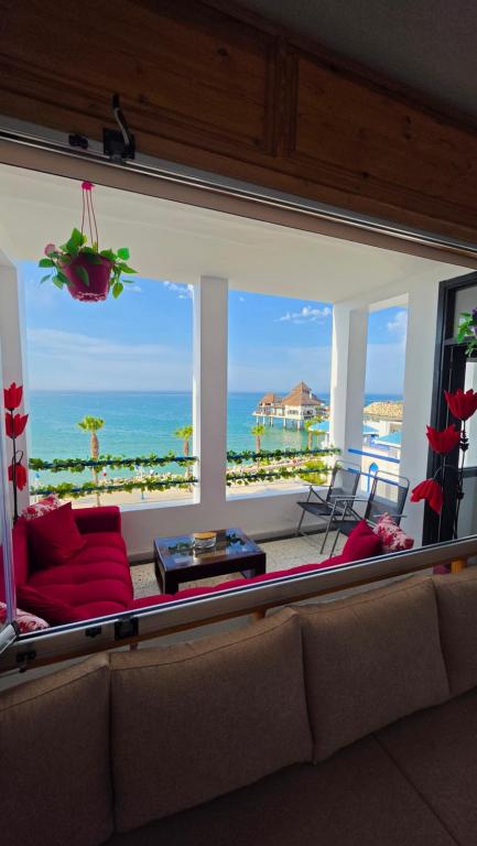 a living room with a view of the ocean at Star beach in M'diq