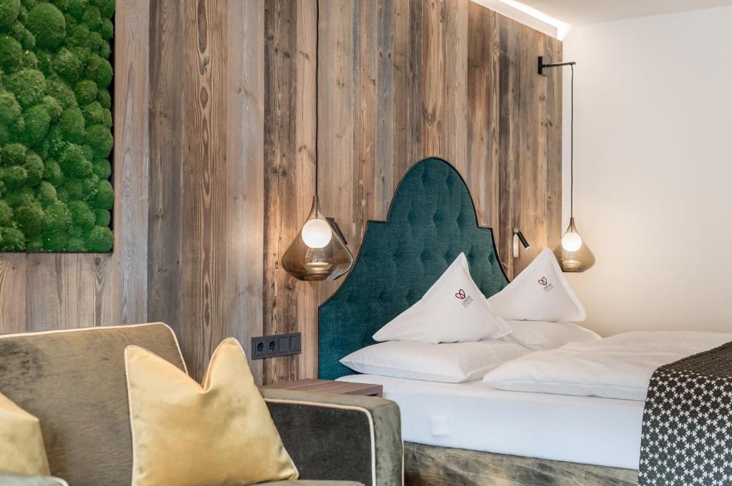 Postel nebo postele na pokoji v ubytování Superior Hotel Edelweiss