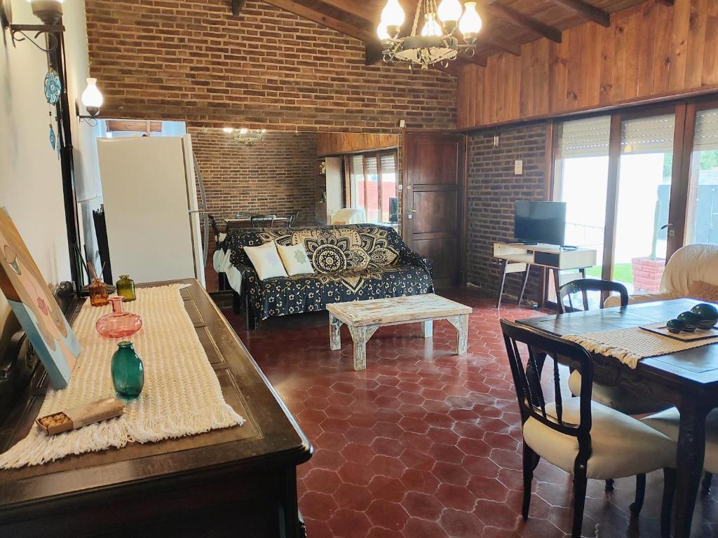 a living room with a couch and a table at El Quincho de Mariana in Balcarce